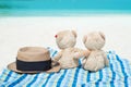 Panama hat and Two teddy bears sitting sea view. Love and relationship concept. Royalty Free Stock Photo