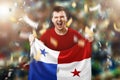 Panamanian fan, fan of a man holding the national flag of Panama in his hands. Soccer fan in the stadium. Mixed media Royalty Free Stock Photo