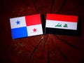 Panamanian flag with Iraqi flag on a tree stump isolated Royalty Free Stock Photo