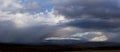 Panarama of storm running over a town