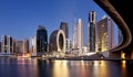 Panaroma of Dubai skyline with Burj khalifa and other skyscrapers at night from Al Jadaf Waterfront, UAE