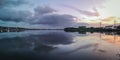 Panaromic shot of a sunrise over a seascape with a reflecton on the water Royalty Free Stock Photo