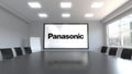 Panasonic Corporation logo on the screen in a meeting room. Editorial 3D rendering
