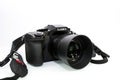 Panasonic G80/ G85 mirrorless photography camera with 25 mm 1,7 lens on white background.