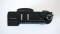 Panasonic Lumix GX80 / GX85 digital mirrorless camera top down view on white background.