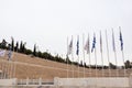 Panathenaic Stadium marble entrance with flags Royalty Free Stock Photo