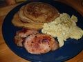 pancake breakfast with scrambled eggs and bacon