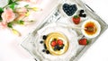 Pancake breakfast tray on table with syrup and blueberries fruit flat lay. Royalty Free Stock Photo