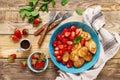 Pancake cereal, mini pancakes with fresh strawberry in a bowl with maple syrup Royalty Free Stock Photo