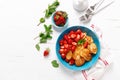 Pancake cereal, mini pancakes with fresh strawberry in a bowl with maple syrup Royalty Free Stock Photo