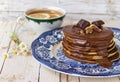 Pancake with chocolate sauce and cup of tea Royalty Free Stock Photo