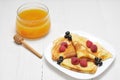 Pancake - Crepes with berries and honey Royalty Free Stock Photo