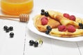 Pancake - Crepes with berries and honey Royalty Free Stock Photo