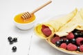 Pancake - Crepes with berries and honey Royalty Free Stock Photo