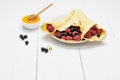 Pancake - Crepes with berries and honey Royalty Free Stock Photo