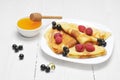 Pancake - Crepes with berries and honey Royalty Free Stock Photo