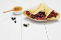 Pancake - Crepes with berries and honey Royalty Free Stock Photo