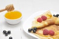 Pancake - Crepes with berries and honey Royalty Free Stock Photo