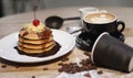 Pancake And Cup Of Coffee And Beans Around