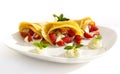 Pancake filled with strawsberries and garnished with mint, syrop and whipped cream