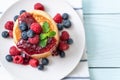 pancake with fresh raspberries and blueberries Royalty Free Stock Photo