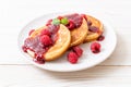 pancake with fresh raspberries and raspberry sauce Royalty Free Stock Photo