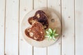 Pancake hearts on a wooden background