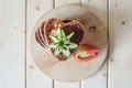 Pancake hearts on a wooden background