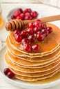 Pancake with honey and fresh berries. Cranberry, cowberry Royalty Free Stock Photo