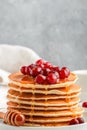 Pancake with honey and fresh berries. Cranberry, cowberry Royalty Free Stock Photo