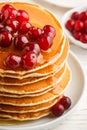 Pancake with honey and fresh berries. Cranberry, cowberry Royalty Free Stock Photo