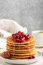 Pancake with honey and fresh berries. Cranberry, cowberry Royalty Free Stock Photo