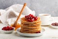 Pancake with honey and fresh berries. Cranberry, cowberry Royalty Free Stock Photo