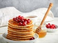 Pancake with honey and fresh berries. Cranberry, cowberry Royalty Free Stock Photo