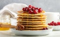 Pancake with honey and fresh berries. Cranberry, cowberry Royalty Free Stock Photo