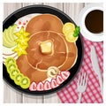 Pancake with kiwi and strawberry toppings in a plate on table background