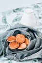 Pancake porridge, mini pancakes in a bowl with maple syrup. Milk on background. Dutch mini pancakes are called strawberry potato Royalty Free Stock Photo