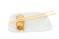 Pancake roll and chopsticks on plate