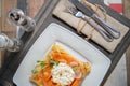 Pancake with salmon and sourcream and dille on a white plate. Royalty Free Stock Photo