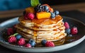 Pancake stack with honey and fruit toppings