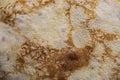 Pancake surface texture and pattern. Close-up of thin hot pancakes in a plate. Traditional rustic food. Graphic resource Royalty Free Stock Photo