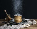 Pancake tower with fresh blueberry and mint on a rustic metal plate. Royalty Free Stock Photo