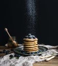 Pancake tower with fresh blueberry and mint on a rustic metal plate. Royalty Free Stock Photo