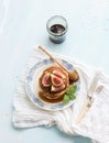 Pancake tower with fresh figs and honey on a Royalty Free Stock Photo