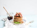 Pancake tower with fresh figs and honey on a Royalty Free Stock Photo