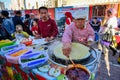 Pancake vendors at an open-air traditional market in Urumqi, Xinjiang, China