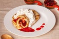 Pancake with whipped cream jam plate still life