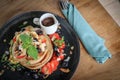 Pancakes with banana, blueberries, strawberries and chocolate sauce Royalty Free Stock Photo