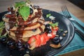 Pancakes with banana, blueberries, strawberries and chocolate sauce Royalty Free Stock Photo