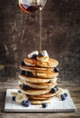 Pancakes with banana, blueberry and maple syrup. Royalty Free Stock Photo